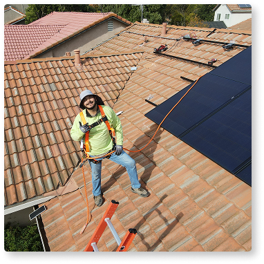 man installing solar panels