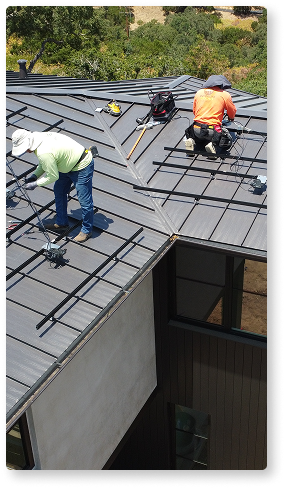 people installing solar panels