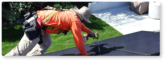 person installing solar panels